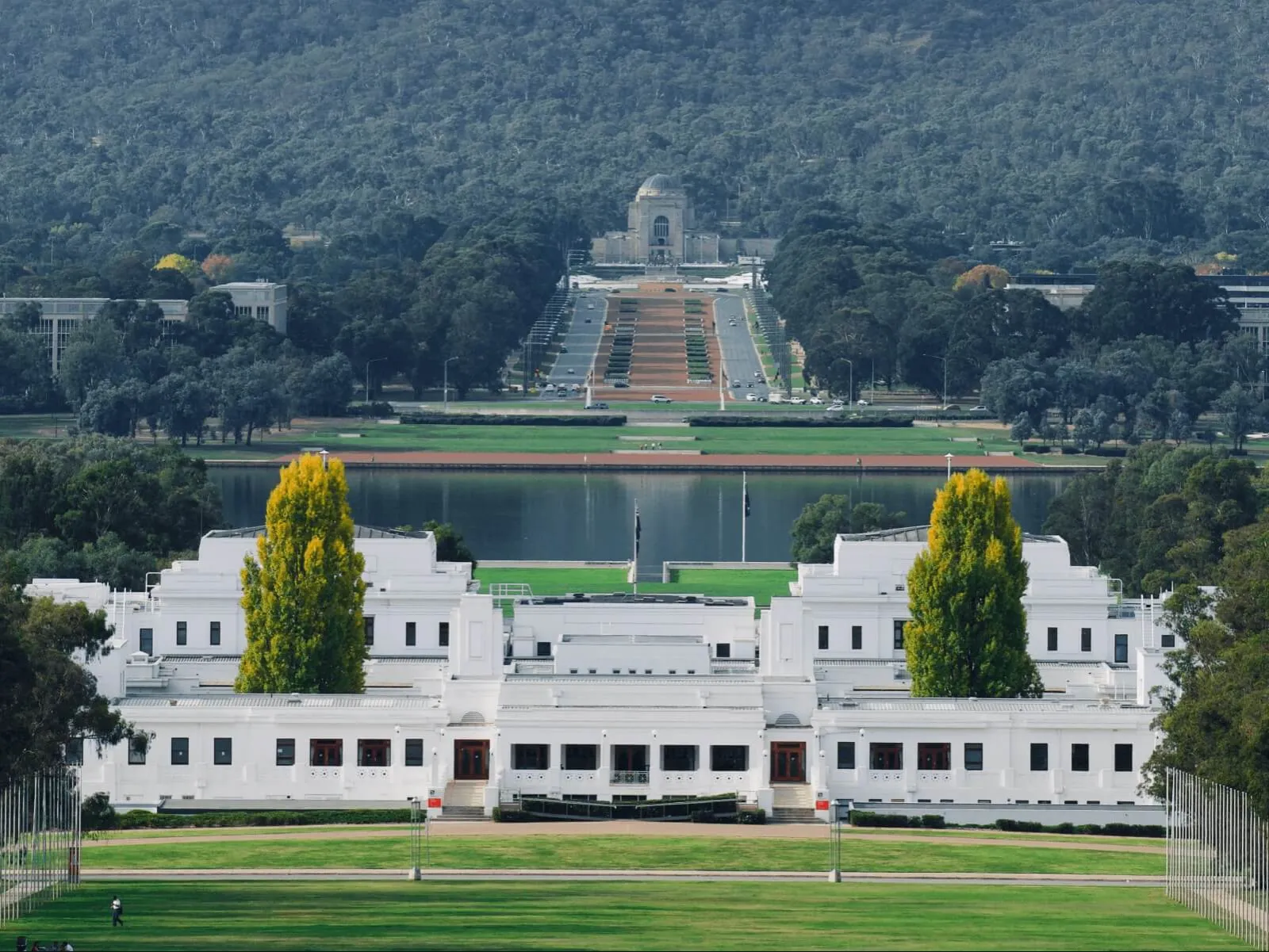 Old Parliament House, with Anzac Parade and the Australian War Memorial behind on the far side of the lake.