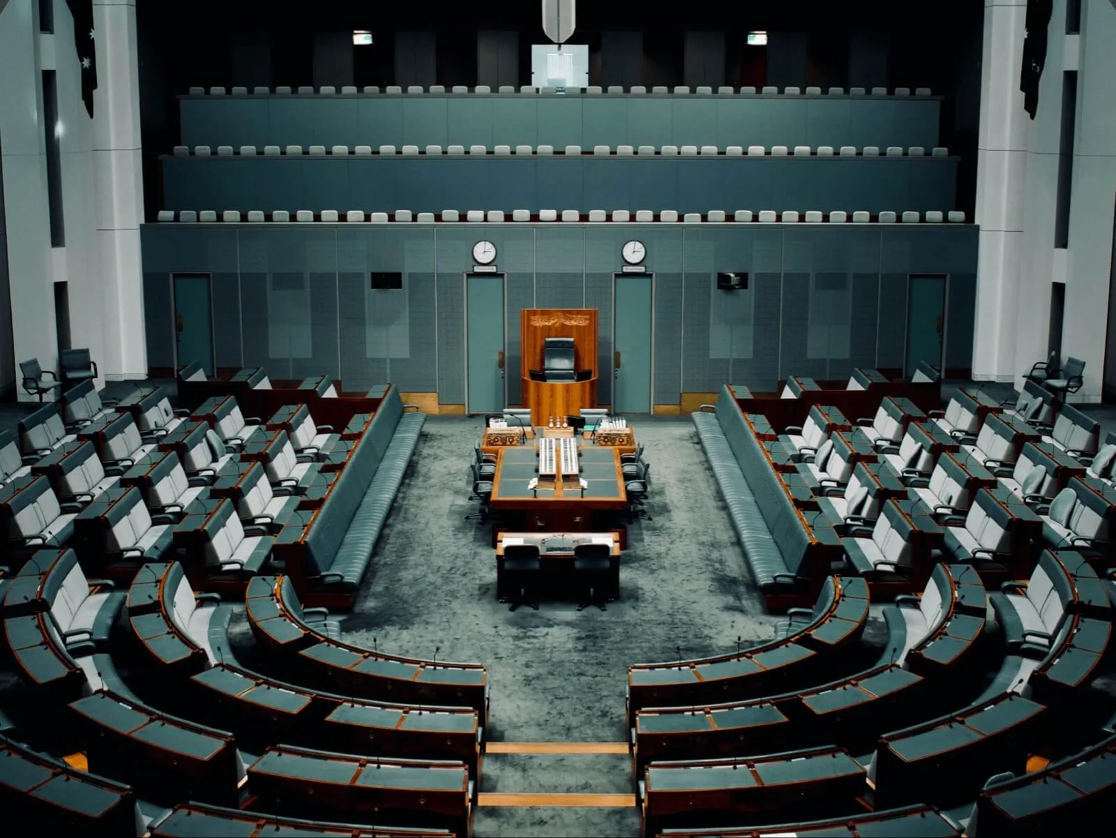 The empty green benches of the House of Representatives chamber.