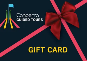 A Canberra Guided Tours gift card with a red ribbon and bow.